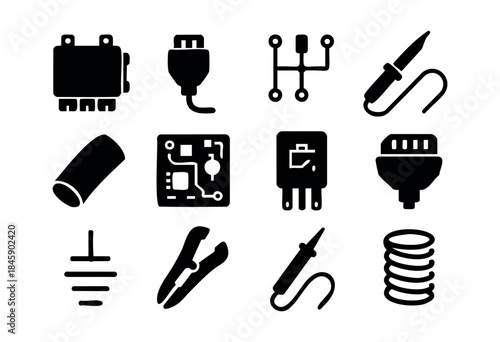 A comprehensive set of black silhouette icons depicting various electronic components, electrical tools, and engineering symbols on a white background — stock vector.