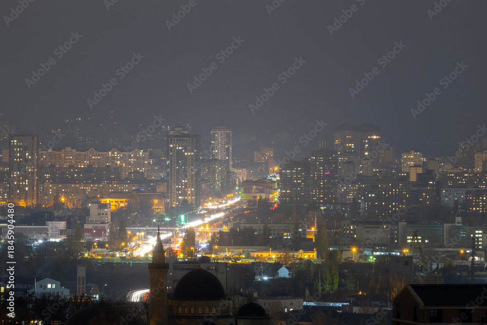 Fototapeta premium Night cityscape with Ar-Rahma Mosque and traffic