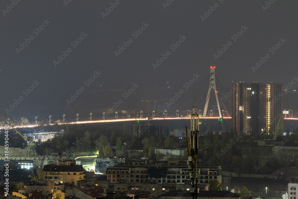 Fototapeta premium Illuminated Northern Bridge and night city traffic