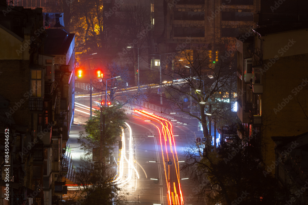 Fototapeta premium Night city intersection with traffic light trails