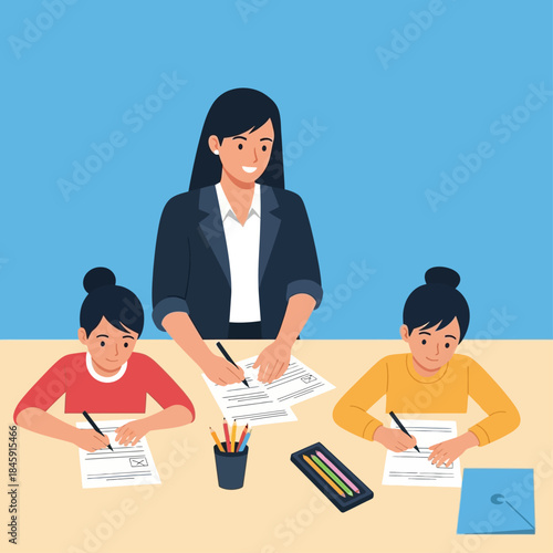 A female teacher helps two young students with their schoolwork at a table.
