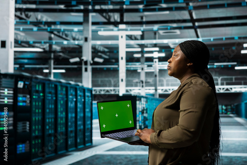 Billede på lærred Data center admin using isolated screen laptop to automate anomaly detection