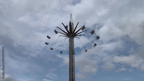 Carousels against the sky. Amusement park.