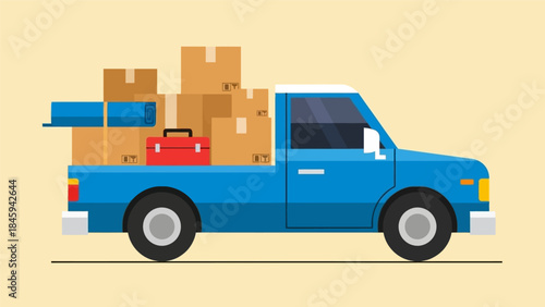 A blue pickup truck loaded with cardboard boxes and luggage is parked on a flat surface, viewed from the side, conveying a sense of transportation and relocation.