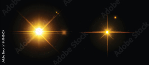 Two glowing yellow light effects with sparks on a black background