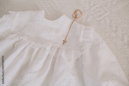 Infant christening gown with golden cross