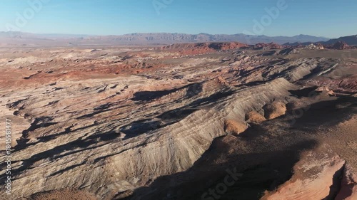 Aerial View of Valley of Fire State Park in Nevada near Las Vegas Capturing the Unique Mountain Landscape of Red Rocks during Golden Hour Sunset - 4K Drone