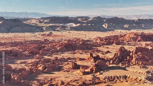 Aerial Panoramic View of Valley of Fire State Park in Nevada near Las Vegas with Unique Red Rock Formations and Vast Landscape during Golden Hour Sunset - 4K Drone