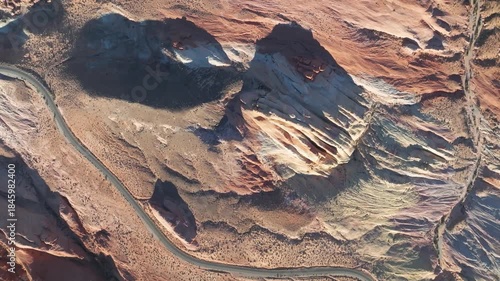 Birds Eye view of Valley of Fire State Park in Nevada near Las Vegas With Landscape Colorful Red Rock Formations and Winding Roads during Golden Hour Sunset - 4K Drone