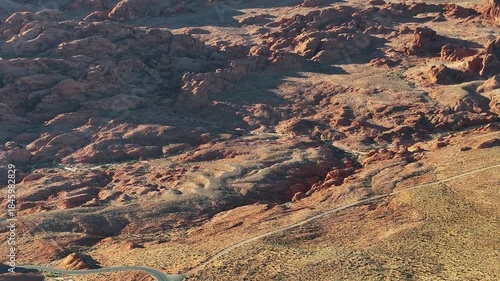 Aerial View of Valley of Fire State Park in Nevada near Las Vegas with Red Rock Formations landscape During golden hour sunset - 4K Drone
