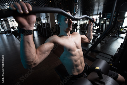 Athlete Doing Heavy Weight Exercise For Back