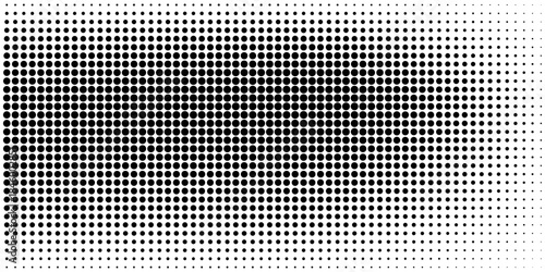Abstract halftone pattern with gradual transition of black dots on white