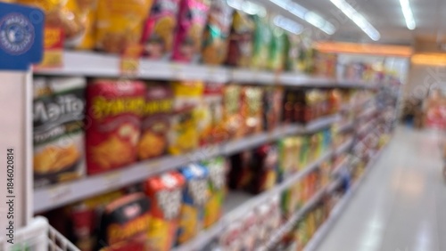 Wallpaper Mural Defocused image of a supermarket aisle. Center and side perspective. Colored product shelves. Torontodigital.ca