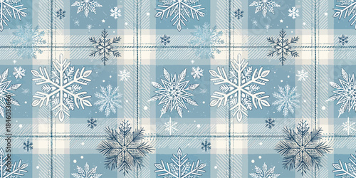 Blue and white snowflake pattern on plaid background, evoking winter's cozy charm.