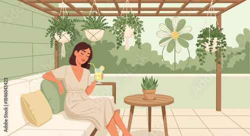 Woman Relaxing on Outdoor Sofa with Drink.