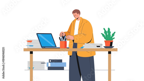 A man in a yellow jacket works at a desk, surrounded by office supplies and plants