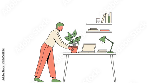 A man tending a plant on his desk in an office environment
