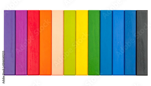 Vertical, colorful, rectangular wooden blocks arranged in a rainbow spectrum
