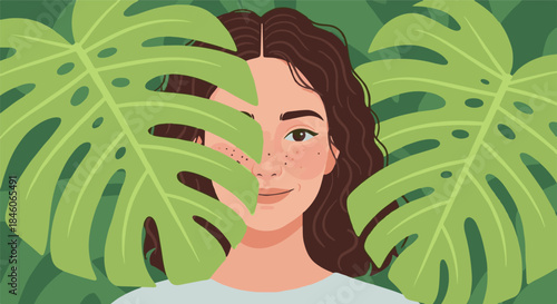 Young woman peeking through large tropical leaves, embracing nature and a sense of wonder
