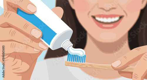 Close up of hands squeezing toothpaste onto a wooden toothbrush, promoting oral hygiene and a healthy smile