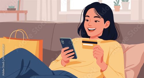 Happy Young Woman Relaxing on Sofa Shopping Online Using Mobile Phone and Credit Card with Shopping Bag Nearby