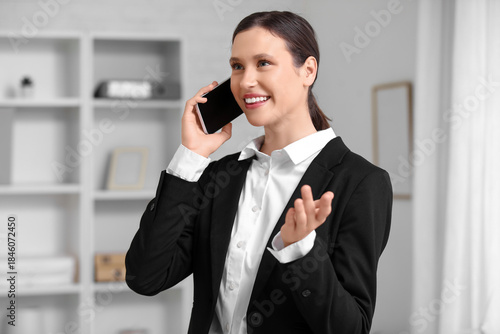 Young businesswoman talking...