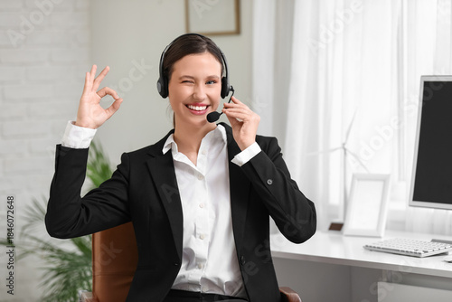 Young businesswoman with he...