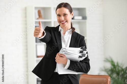 Young businesswoman with do...