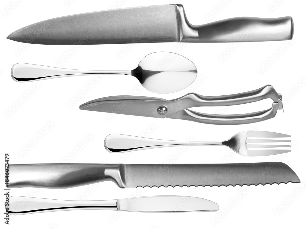 Obraz premium studio photograph of assorted silver kitchen cutlery arranged on a transparent background, including knives, spoons, a pair of shears, and a fork, shiny and metallic