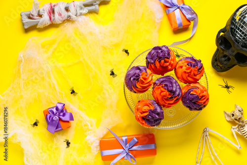 Tasty cupcakes with gift bo...