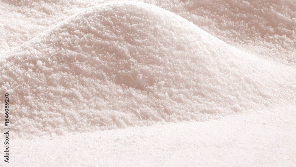 Obraz premium Close-up abstract view of a mound of fine, powdery substance, possibly snow, sand, or a similar material
