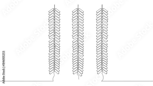 Symmetrical patterns of metal wire structures resembling stylized feathers or botanical motifs