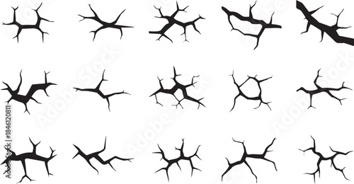 A collection of diverse black crack patterns with jagged edges on a clean white surface
