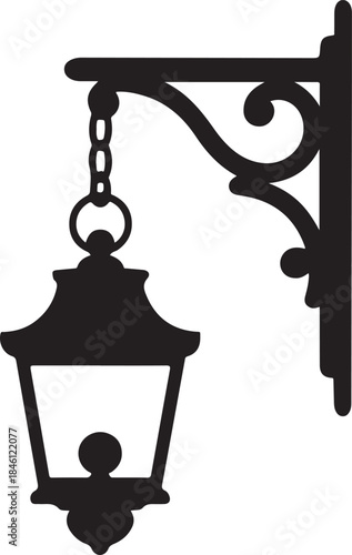 An elegant black silhouette of a vintage ornate street lantern hanging from a decorative wall bracket