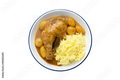 Chicken curry with yellow color turmeric rice isolated on white