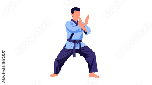 Young Man Practicing Martial Arts Performing a Karate Pose in a Training Studio