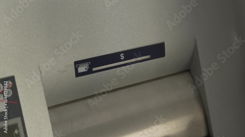 ATM cash dispenser indicator blinking green. Cash withdrawal in progress at bank machine. Automated banking transaction and money access concept