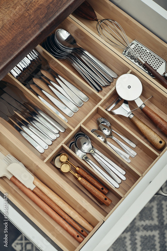 Bamboo organizer with cutlery in kitchen drawer