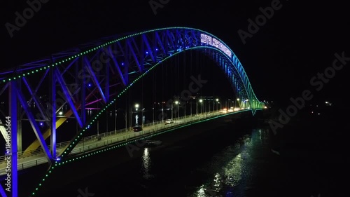 Kutai Kartanegara Bridge, East Kalimantan Indonesia, Night aerial view with car and motorcycle traffic in the middle of the bridge October 27 2021