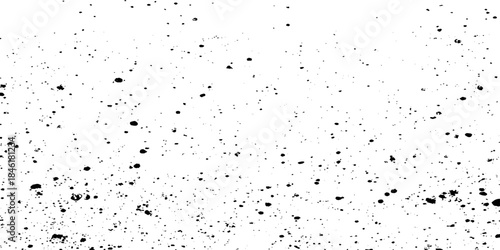 Scattered black speckles on a pure white background creating a grainy texture