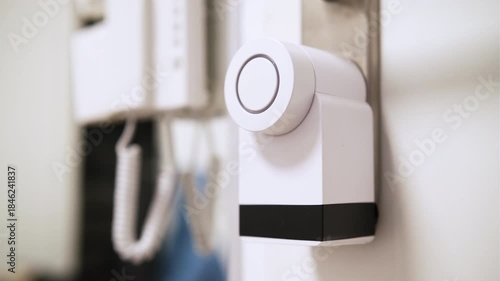 Close up of a smart door lock with blinking led button smart home technology.