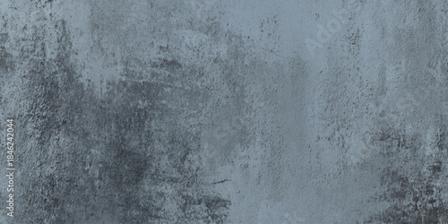 Gray grunge concrete wall texture background with weathered distressed surface with subtle variations in tone.