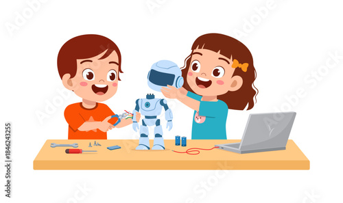 Two happy children smiling and building a robot on a desk with tools and a laptop