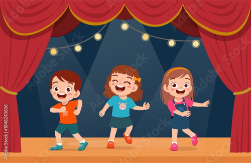 Cheerful happy children dancing on a brightly lit stage with red curtains performing with joy and smile