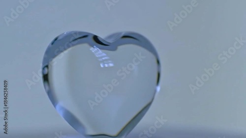 Wallpaper Mural Dynamic Transparent Glass Heart Shape Fluidly Morphing on a Light Background. Abstract Love, Emotion, and Fragility Concept. Torontodigital.ca