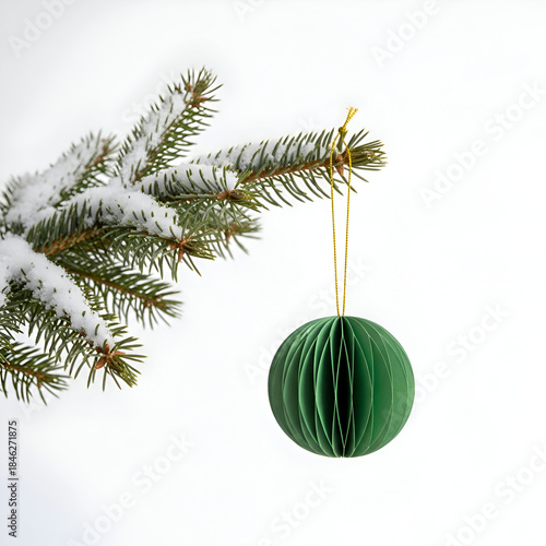 christmas  papaer ornament  hanging with snow and tree branch on a white background