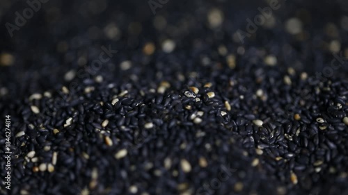 Rotating black sesame seeds, sesame oil