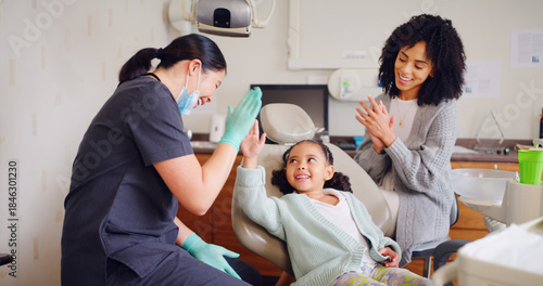 Fotografie Child, high five and dentist for consultation with discussion, oral hygiene and mouth cleaning service
