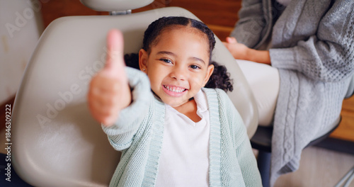 Fotografie Portrait, smile and thumbs up with girl at dentist for optometry goals, success or support