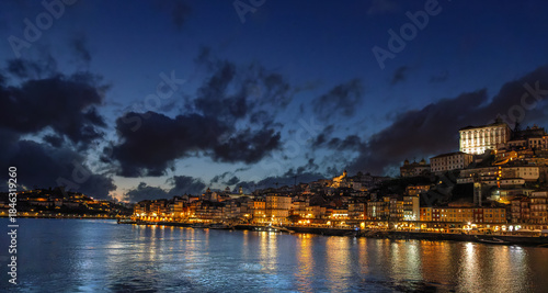 View over the Rio Douro on the old town in Porto, Portugal, at night.